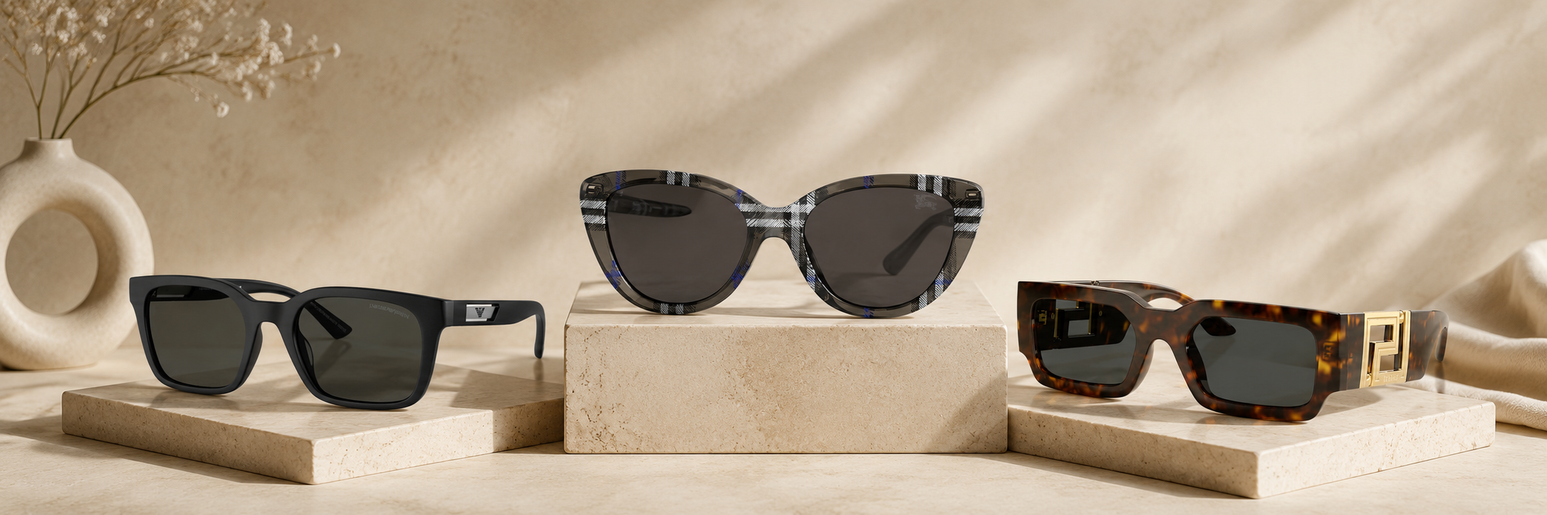 Curated sunglasses arranged on a warm neutral background for The Wola sunglasses collection