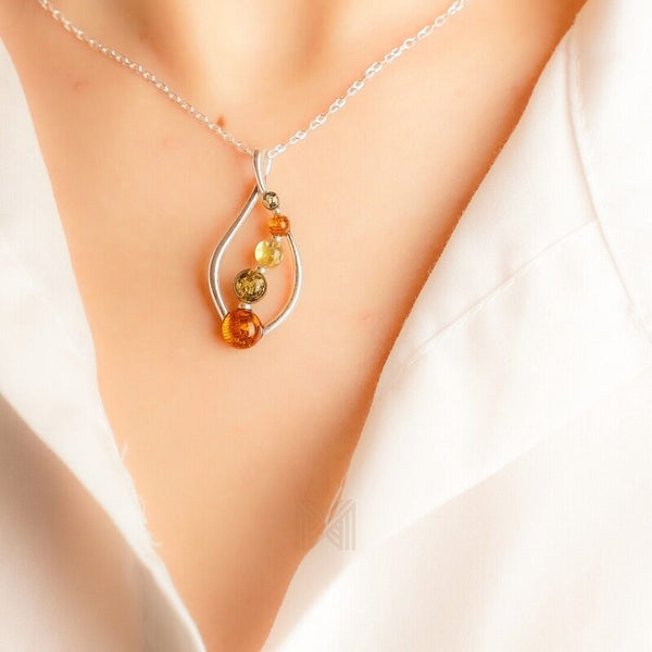 MILLENNE Multifaceted Baltic Amber Curved Oval Silver Pendant with 925 Sterling Silver